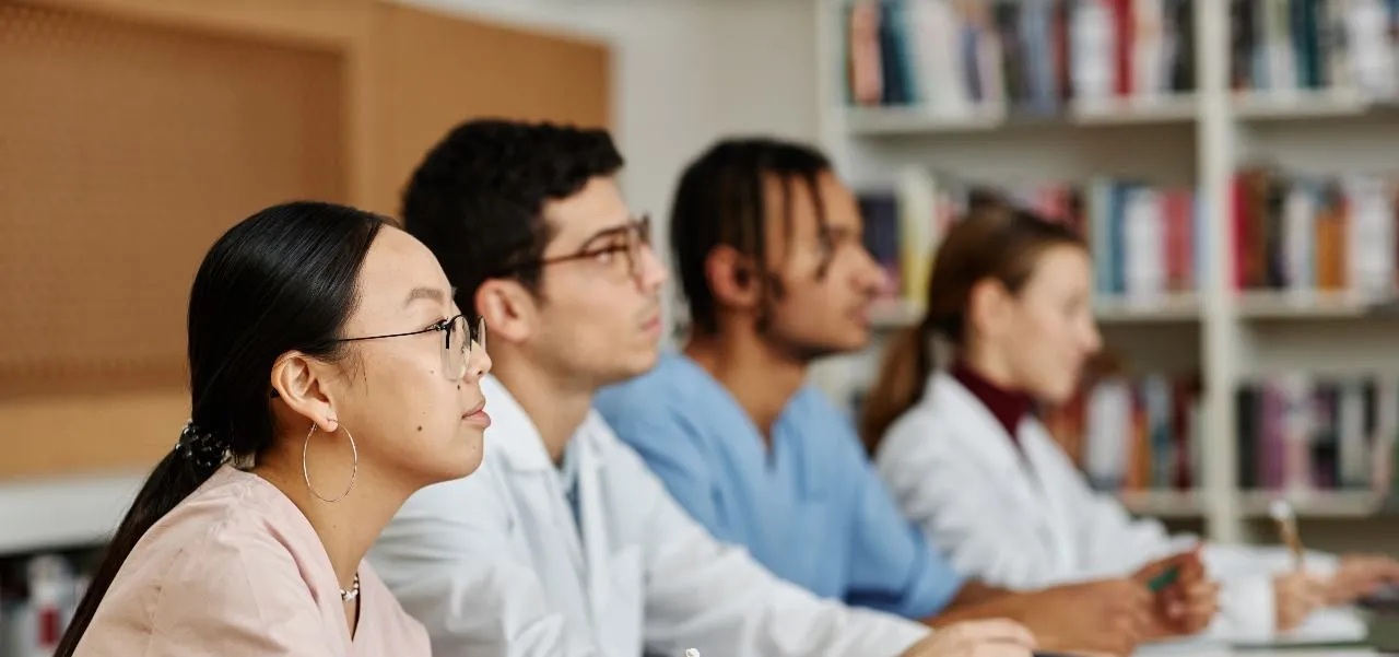 nursing students in a classroom preparing the NCLEX exam